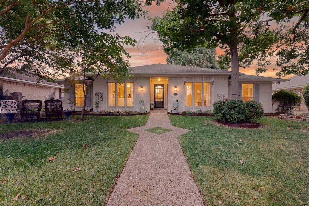 2003 J J Pearce Drive, Richardson, TX 75081 Single-story residence featuring a light-colored brick exterior