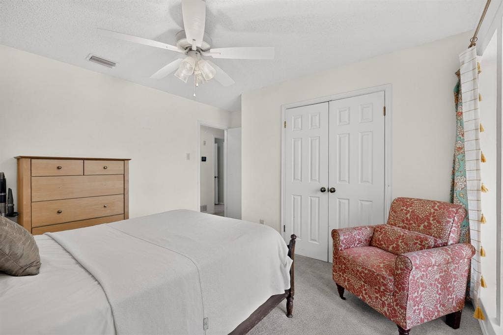 2003 J J Pearce Drive, Richardson, TX 75081 Interior room featuring light-colored walls and grey carpet flooring