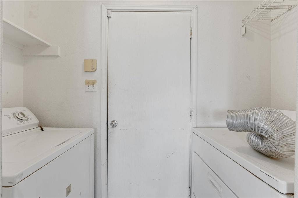 2312 Corral Drive, Fort Worth, TX 76133 Laundry area featuring a built-in shelf and wire rack storage