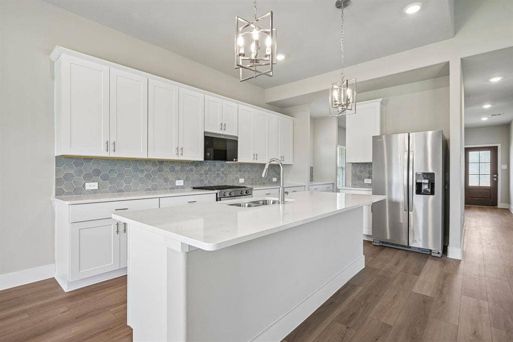 1303 Winters Way, Princeton, TX 75071 Photo is not of the actual home, but is an inspirational photo of builder’s model home and may depict options, furnishings, and/or decorator features that are not included.