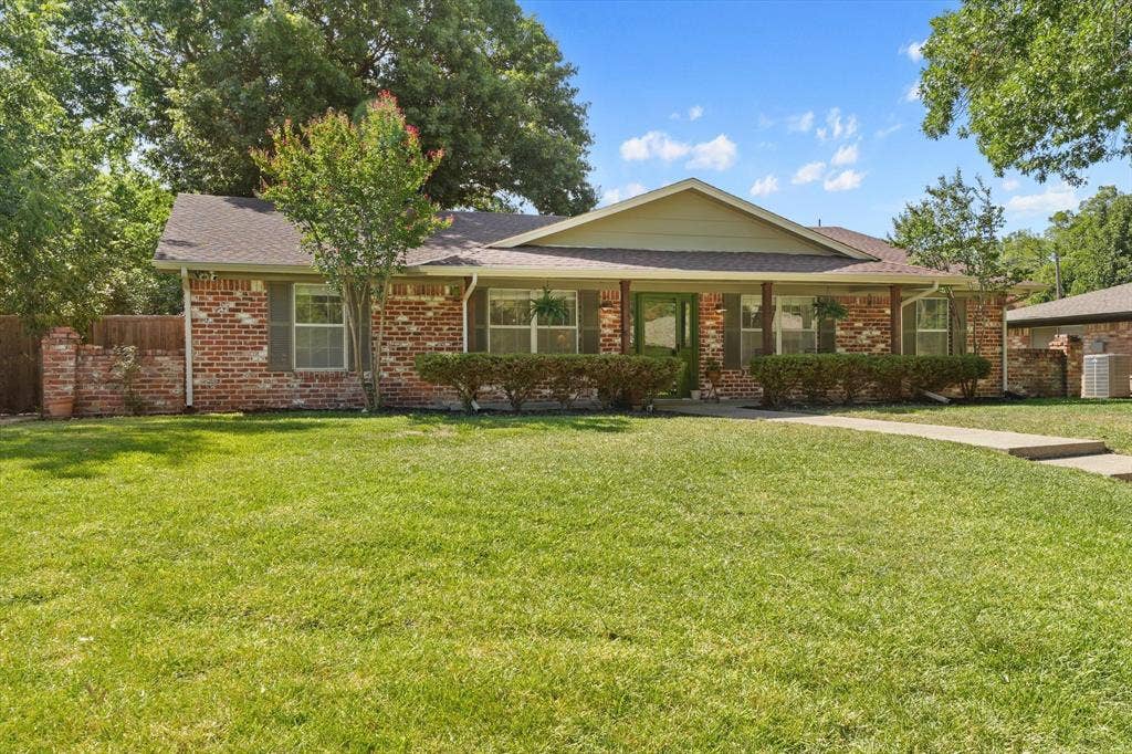 1112 Woodmount Court, Denton, TX 76209 Large front lawn and inviting covered porch create a welcoming first impression just minutes from Avondale Park, Nette Shultz Park, and downtown Denton.
