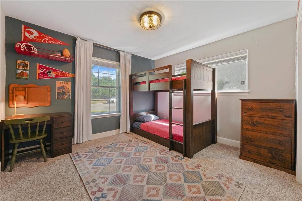 1112 Woodmount Court, Denton, TX 76209 Large secondary bedroom with abundant natural light, updated finishes, and flexible space for growing families or guests.