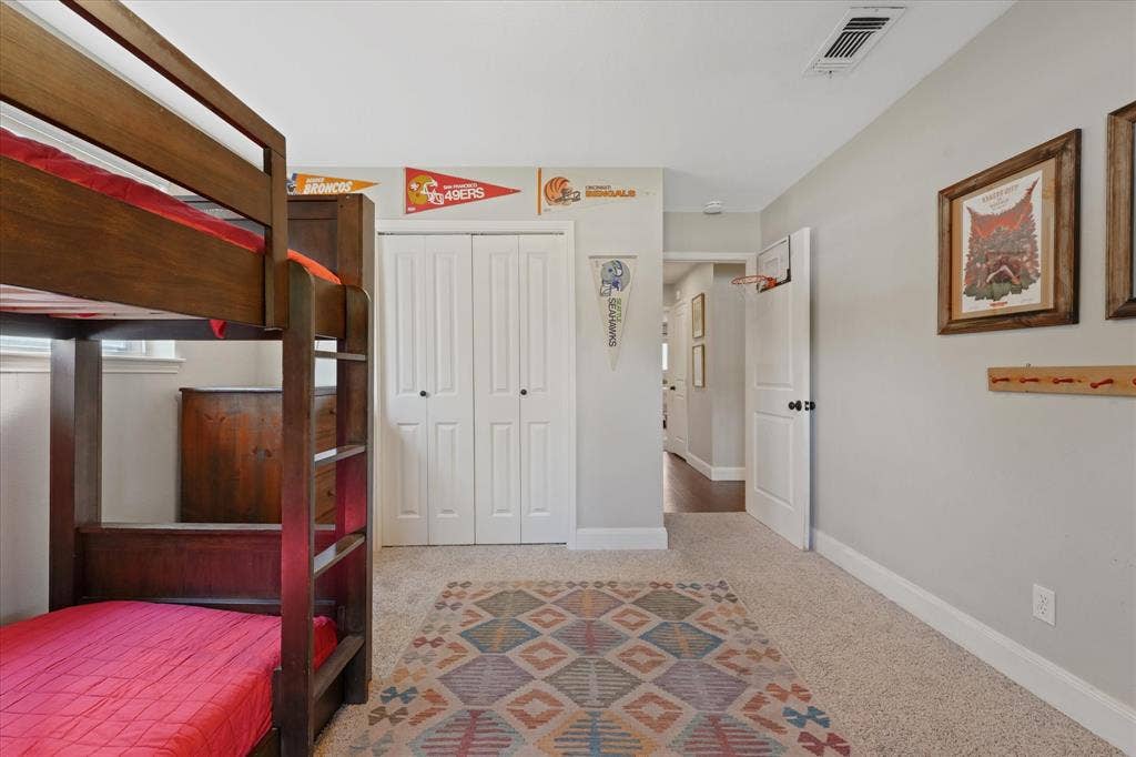 1112 Woodmount Court, Denton, TX 76209 Additional view of the oversized secondary bedroom highlighting generous floor space, closet storage, and neutral décor ready for any style.