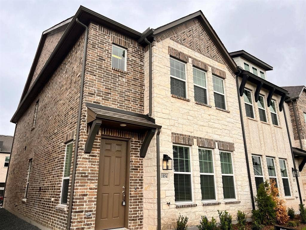 1054 Old Rosebud Drive, Allen, TX 75013 Multi-story townhome featuring a stone and brick facade
