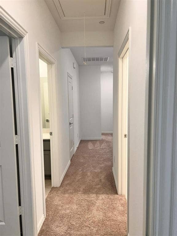 1054 Old Rosebud Drive, Allen, TX 75013 Carpeted hallway featuring white walls and baseboards