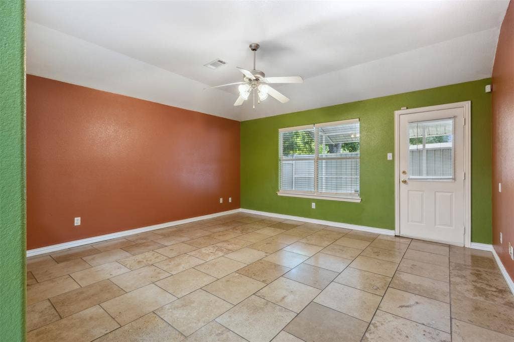 8614 Torreon Court, Dallas, TX 75217 Tiled spare room featuring ceiling fan