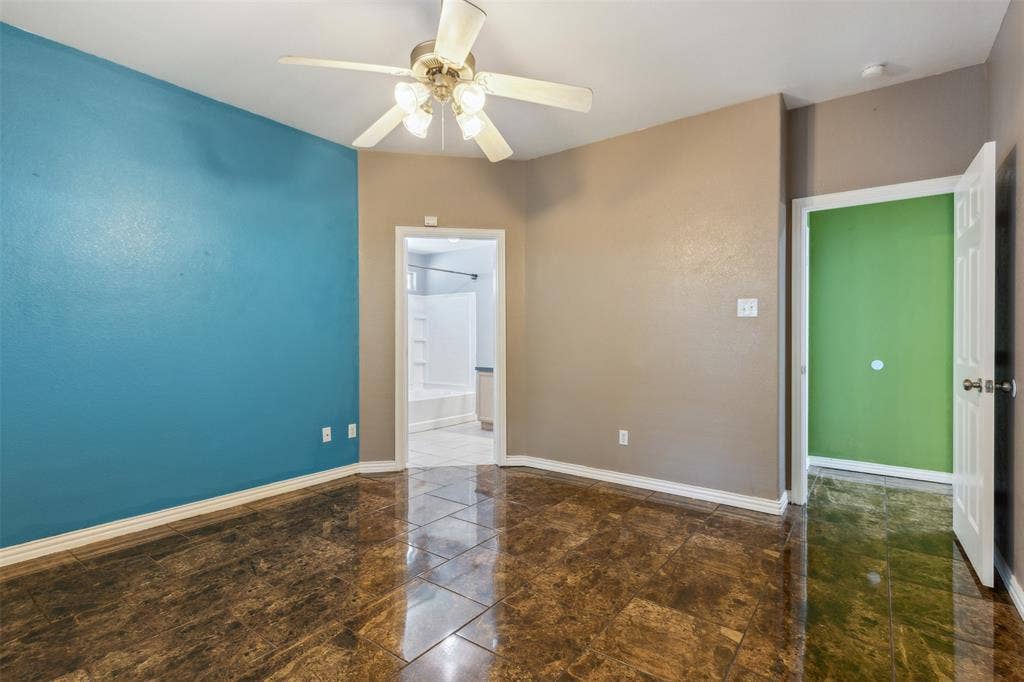 8614 Torreon Court, Dallas, TX 75217 Tiled spare room with ceiling fan