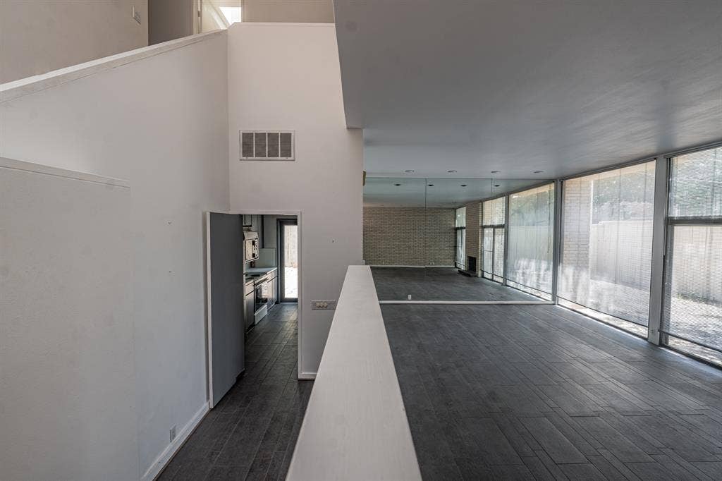 2818 Welborn Drive, #9, Dallas, TX 75219 Living area with wonderful windows and entrance to the kitchen