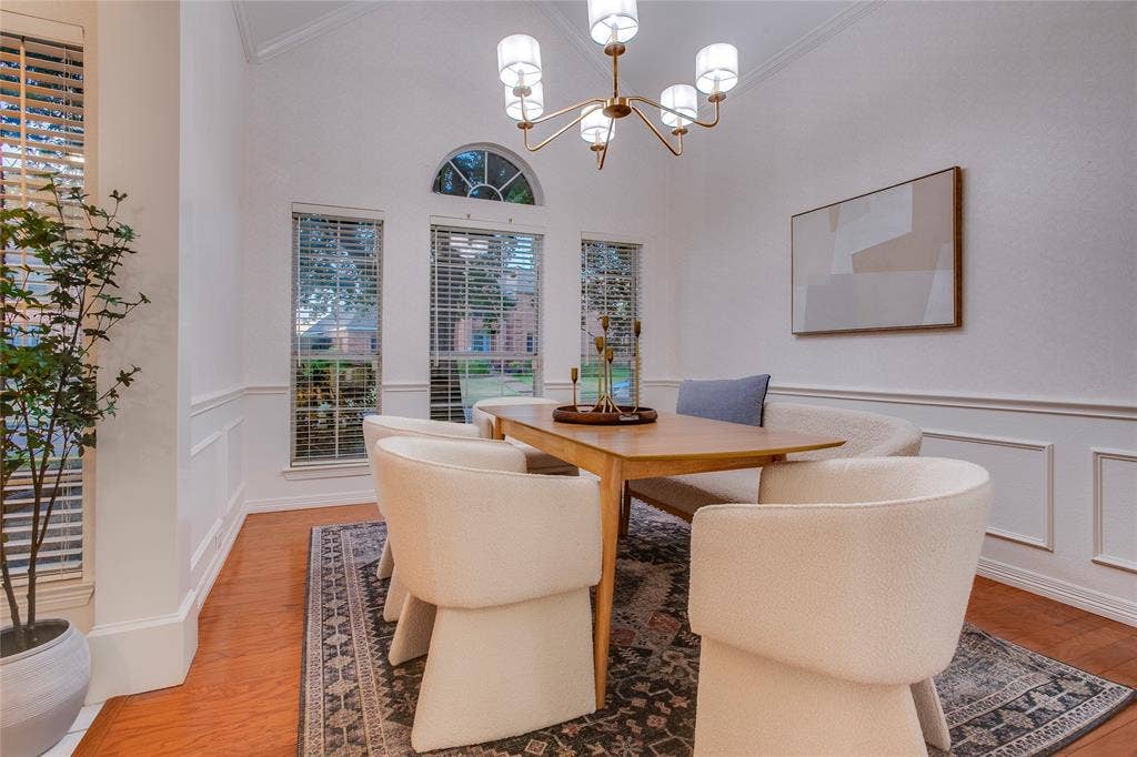 2116 Glendale Drive, Plano, TX 75023 Classic elements create an upscale space for formal dining. Crown molding at the ceiling, picture molding below the chair rail with papered walls above and a Palladian window accentuate the room.