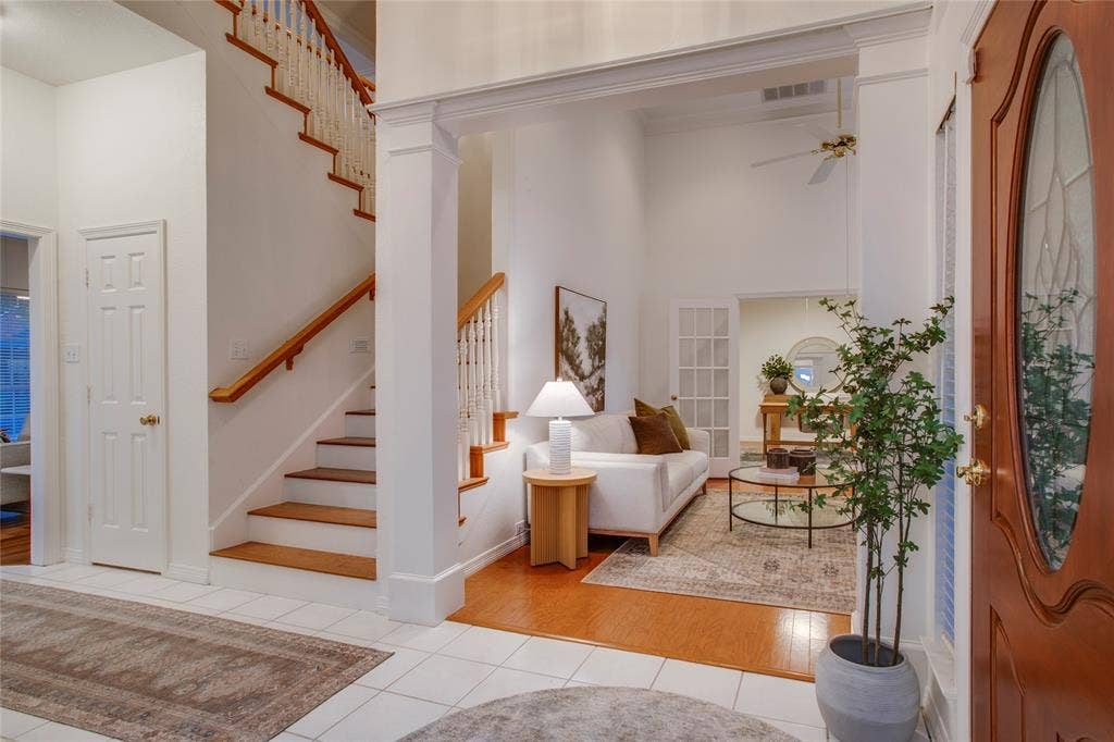2116 Glendale Drive, Plano, TX 75023 The staircase is open and the treads are wood with painted risers.