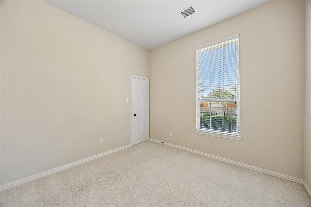 Secondary bedroom with large walk in closet