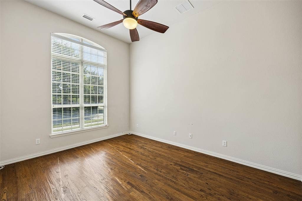 Office featuring wood-finish flooring, and vaulted ceiling.