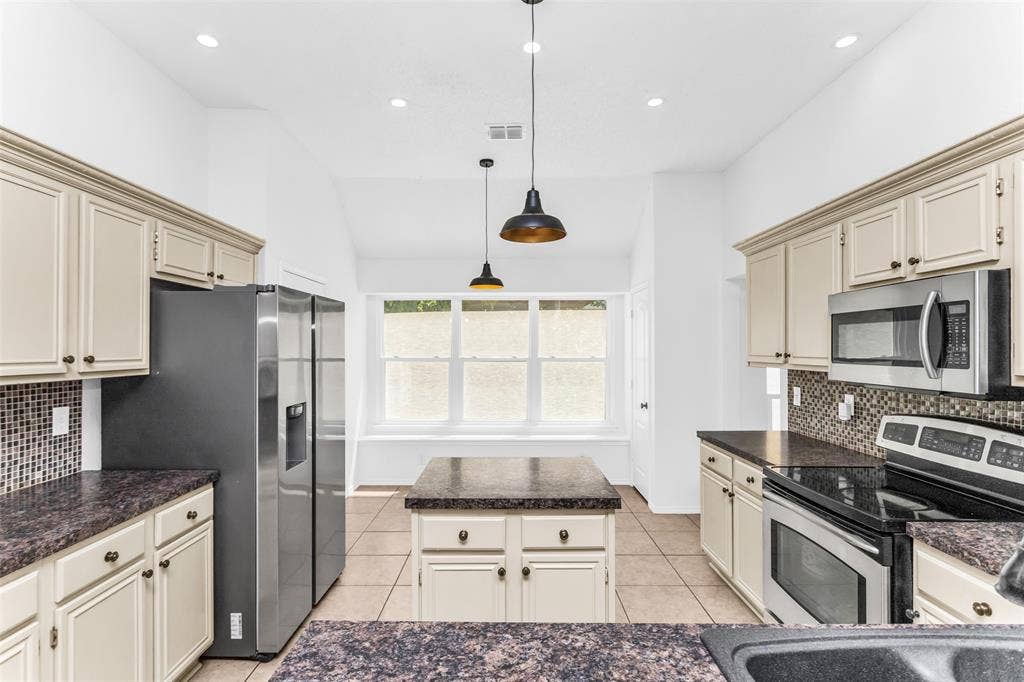 11404 Amber Valley Drive, Frisco, TX 75035 Kitchen featuring recessed lighting, a built-in oven, and a mosaic tile backsplash