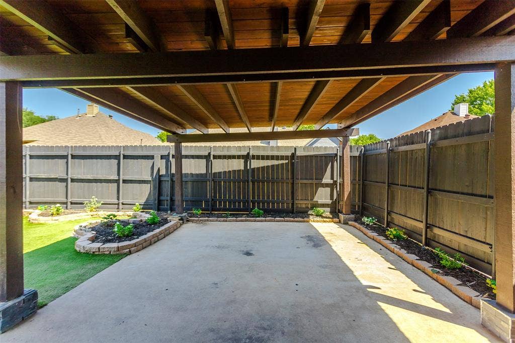 11404 Amber Valley Drive, Frisco, TX 75035 Covered patio featuring wood ceiling and structural beams