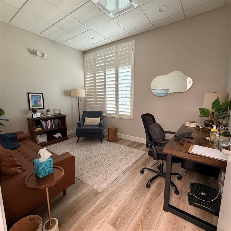 945 Stockton Drive, #7120, Allen, TX 75013 Room featuring wood-finish flooring, a neutral wall palette, and white plantation shutters