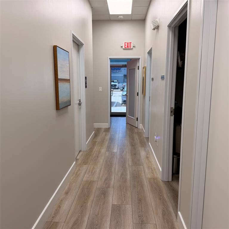 945 Stockton Drive, #7120, Allen, TX 75013 Hallway featuring wood-finish flooring, recessed lighting, and a white baseboard trim
