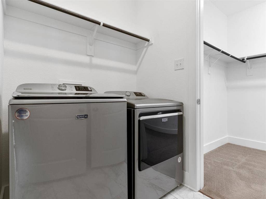 942 Lawless Lane, Fate, TX 75087 Laundry room with Maytag Appliances- conveniently located off primary closet.