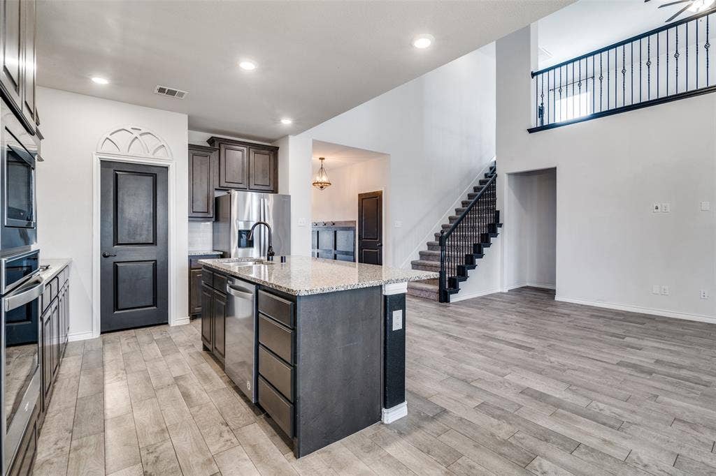 3094 Maverick Drive, Heath, TX 75126 Open floor plan with views of gameroom/flex space upstairs