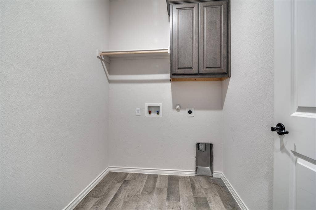 3094 Maverick Drive, Heath, TX 75126 Large utility room with storage.