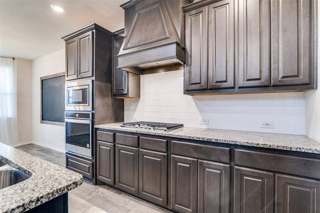 3094 Maverick Drive, Heath, TX 75126 Stainless steal appliances and gas cooktop