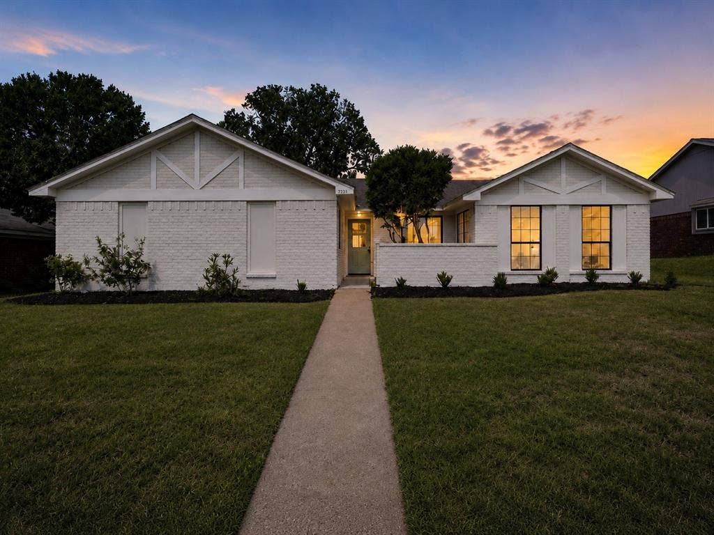 7321 Burke Circle, Plano, TX 75025 White brick exterior with black framed windows