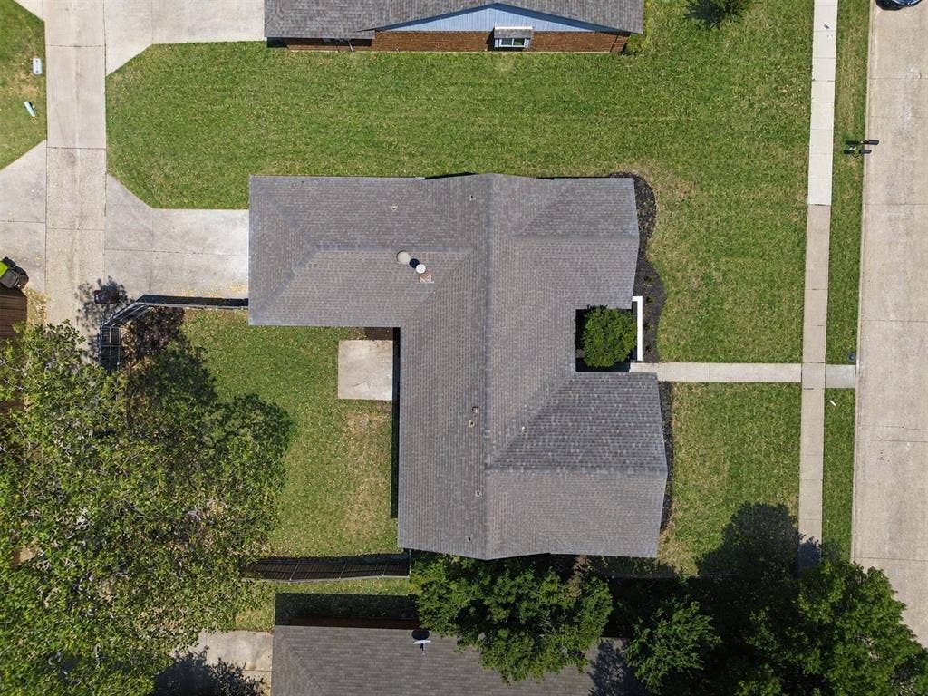 7321 Burke Circle, Plano, TX 75025 Asphalt shingle roof, concrete driveway, concrete sidewalk, front yard, and backyard