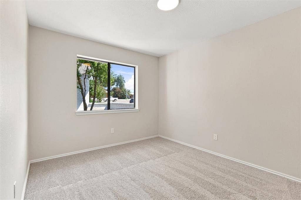 7321 Burke Circle, Plano, TX 75025 Wall-to-wall carpeting, neutral wall finishes, and a single window with a white sill
