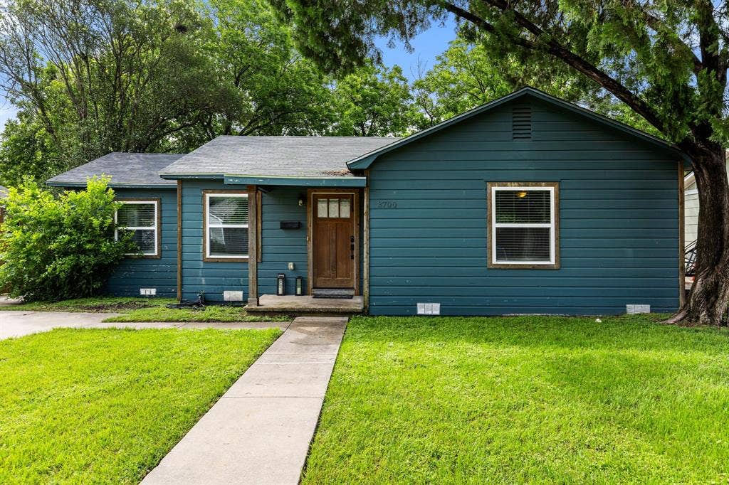 3700 Charlton Avenue, Waco, TX 76711 Charming residence featuring a rich blue exterior siding