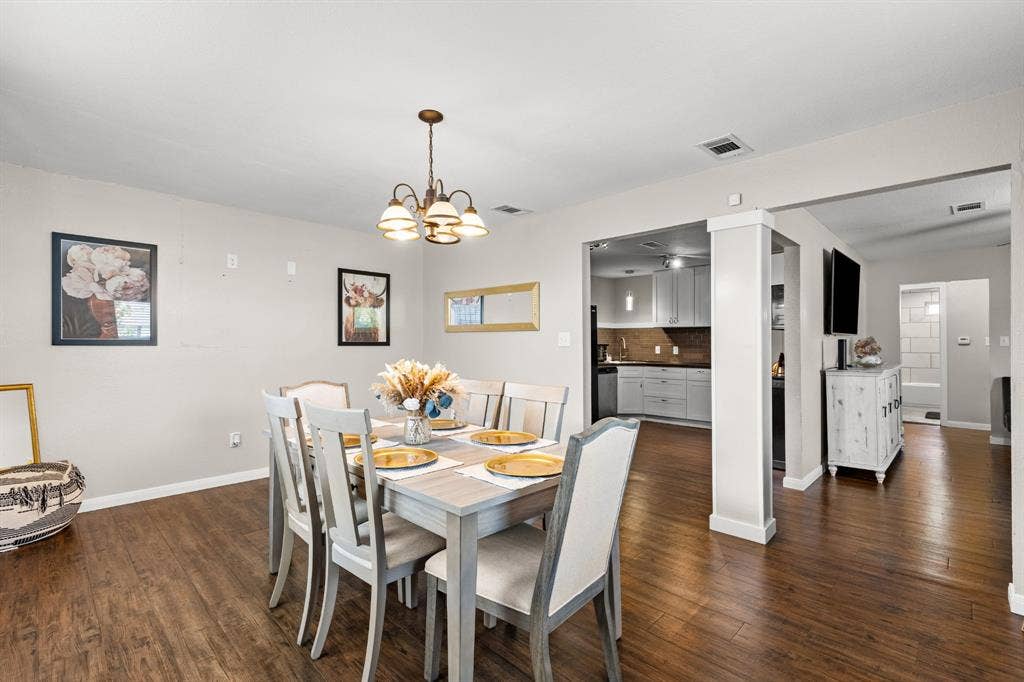 3700 Charlton Avenue, Waco, TX 76711 Dining area featuring wood-finish flooring and a ceiling-mounted chandelier