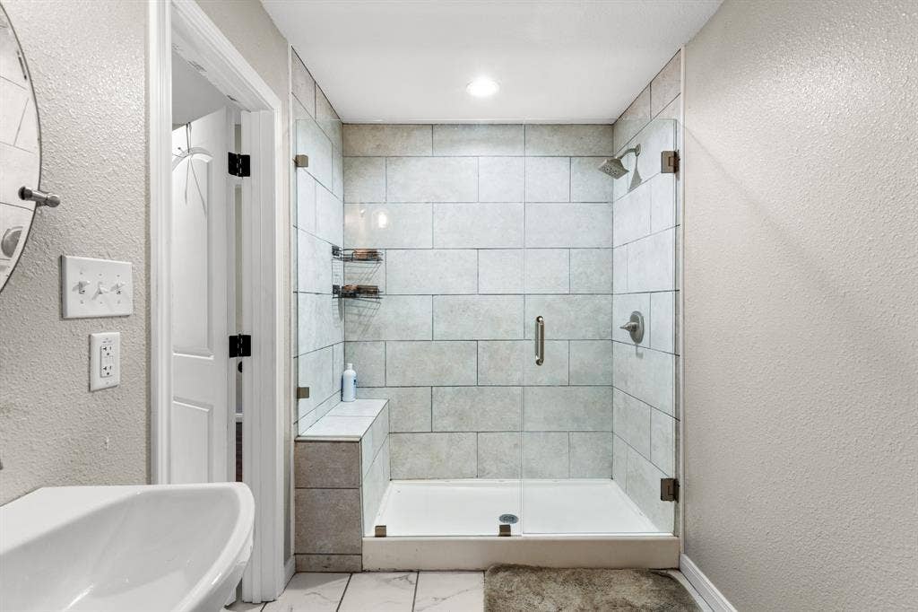 3700 Charlton Avenue, Waco, TX 76711 Contemporary shower enclosure featuring glass panels and a built-in bench