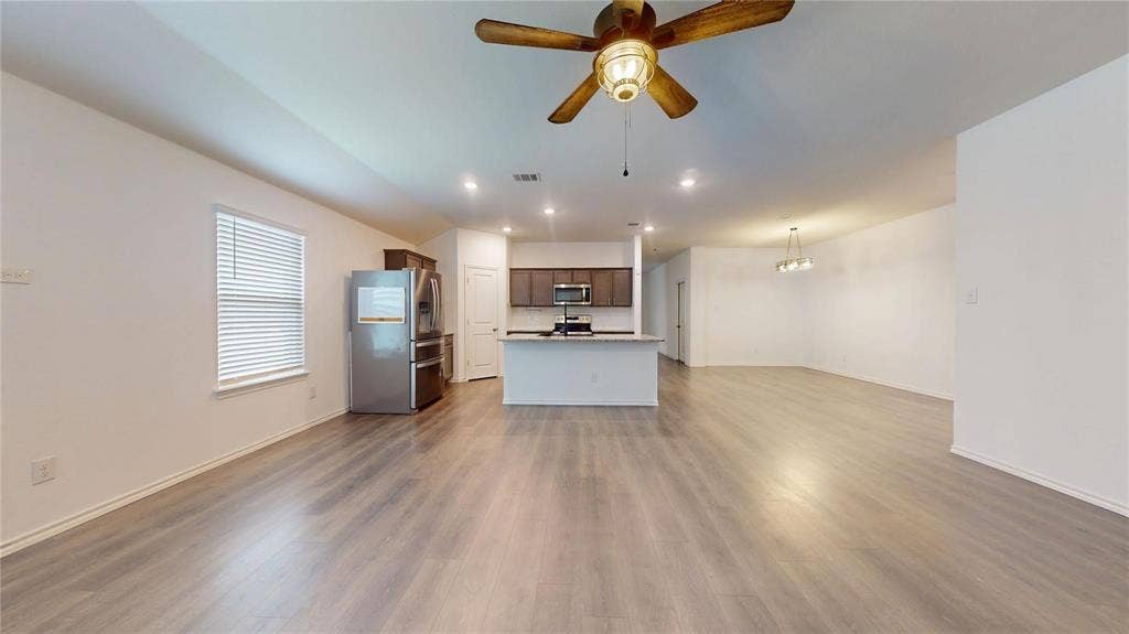 717 Cottonwood Way, Royse City, TX 75189 Open-concept living area featuring wood-finish flooring, recessed lighting, and a ceiling fan