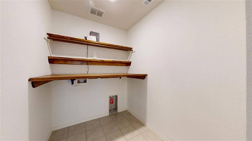 717 Cottonwood Way, Royse City, TX 75189 Laundry area featuring light-toned tile flooring and white walls