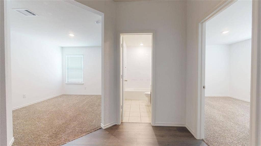 717 Cottonwood Way, Royse City, TX 75189 Interior hallway with wood-finish flooring, recessed lighting, and white trim