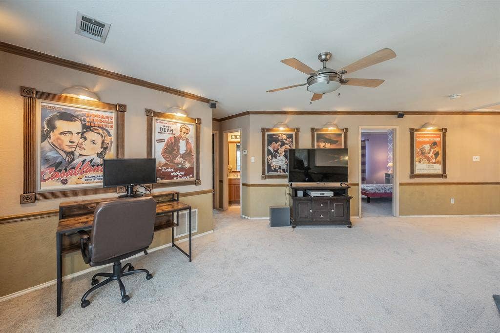 812 Chaparral Drive, Grand Prairie, TX 75052 Carpeted interior space featuring a ceiling fan, crown molding, and wainscoting
