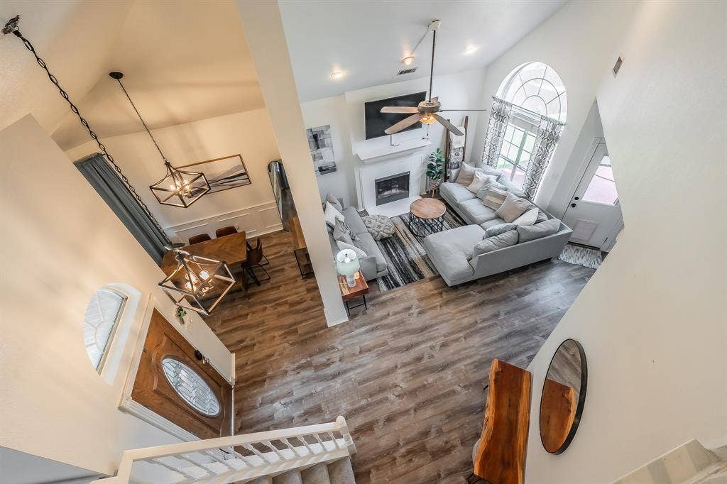 812 Chaparral Drive, Grand Prairie, TX 75052 Open-concept interior featuring high ceilings and wood-finish flooring