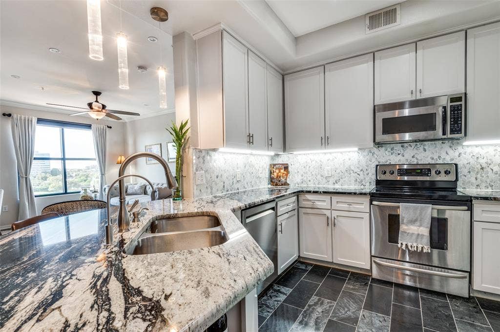 330 Las Colinas Boulevard E, #1016, Irving, TX 75039 Kitchen with designer granite and backsplash