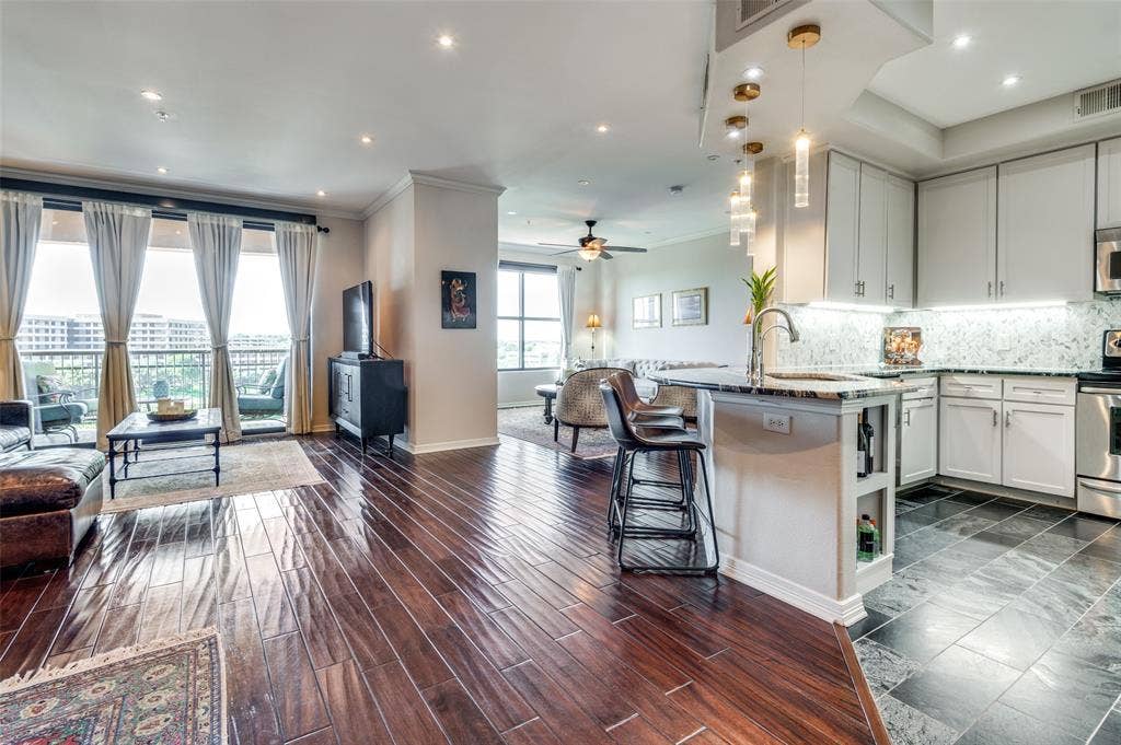 330 Las Colinas Boulevard E, #1016, Irving, TX 75039 Another view of the kitchen and living room shows openness that promotes easy entertaining