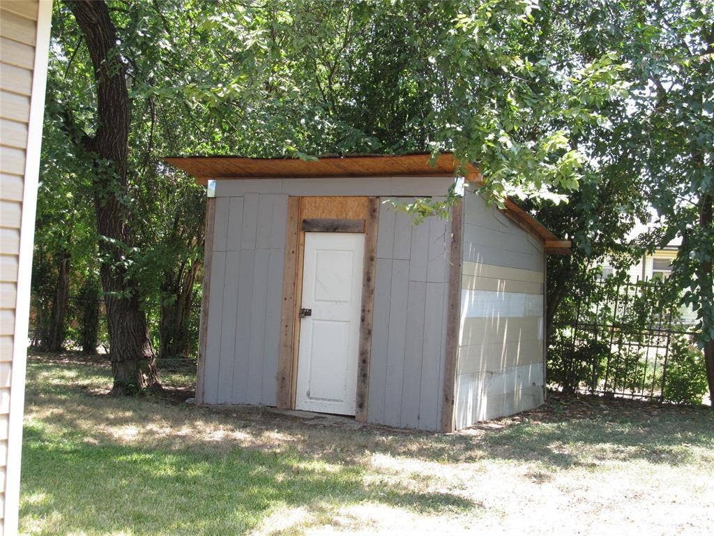 740 Emberwood Drive, Dallas, TX 75232 REAR VIEW OF THE BACK YARD WITH HAND BUILT SHED