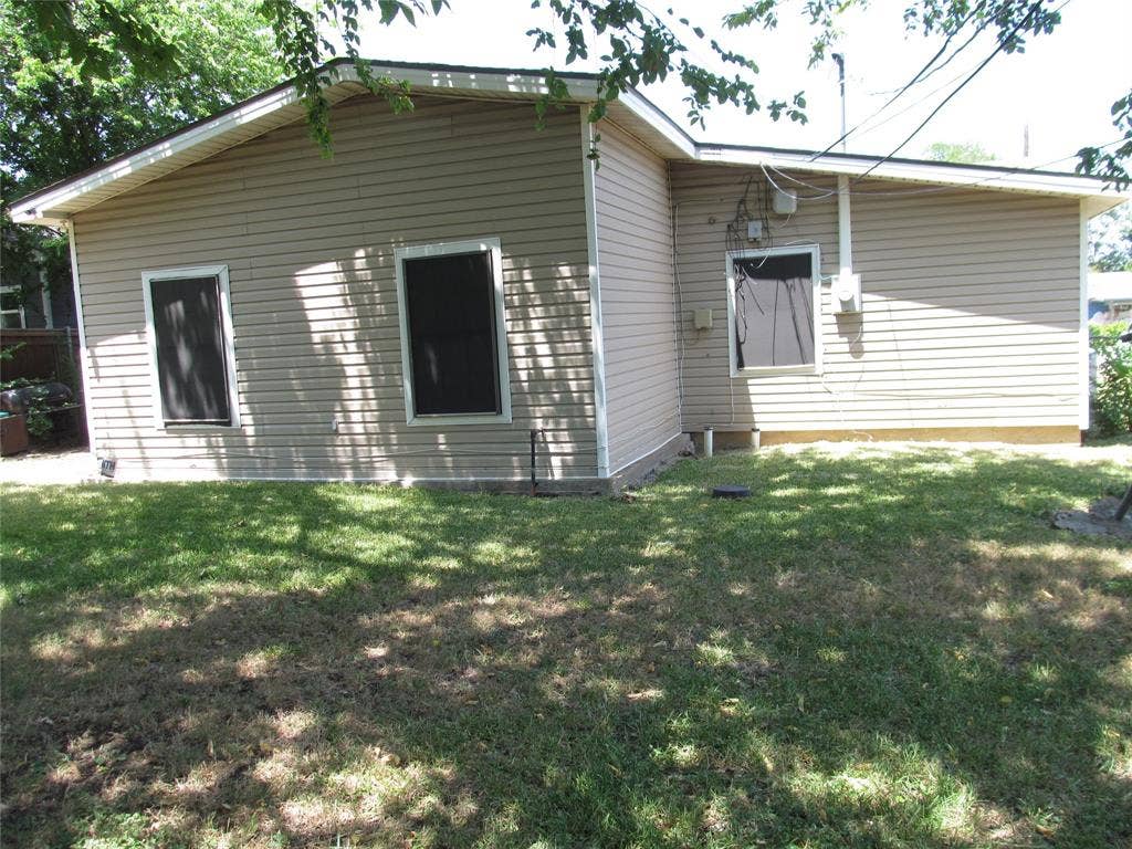 740 Emberwood Drive, Dallas, TX 75232 REAR OF HOME CLOSE UP VIW OF YARD AND BACK OF HOME
