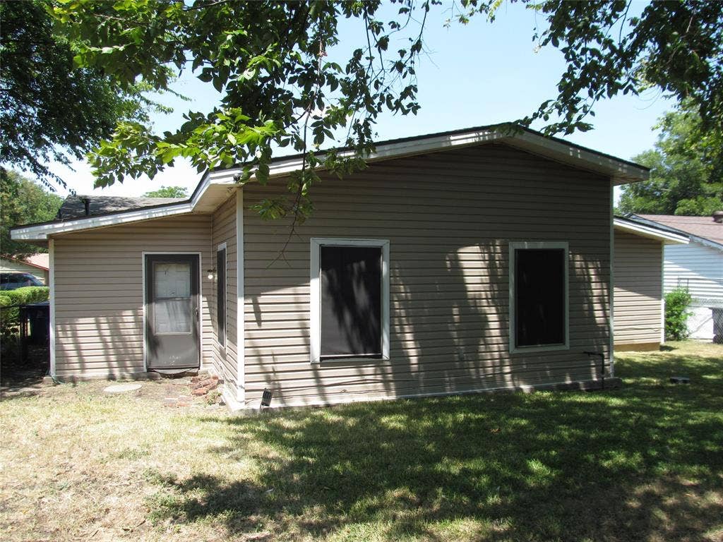 740 Emberwood Drive, Dallas, TX 75232 REAR LEFT VIEW OF BACK YARD WITH VIEW OF REAR BACK DOOR AND REAR OF HOME