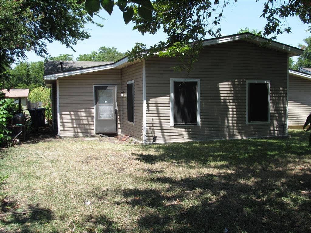 740 Emberwood Drive, Dallas, TX 75232 REAR LEFT VIEW OF BACK DOOR AND REAR OF HOME ANGLE #2
