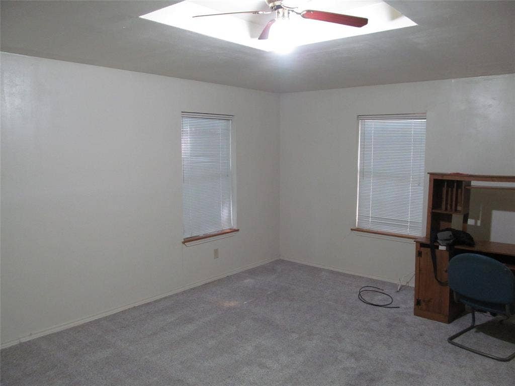 740 Emberwood Drive, Dallas, TX 75232 Recessed ceiling with integrated lighting, ceiling fan, two windows with blinds, and carpeted flooring- PRIMARY BEDROOM