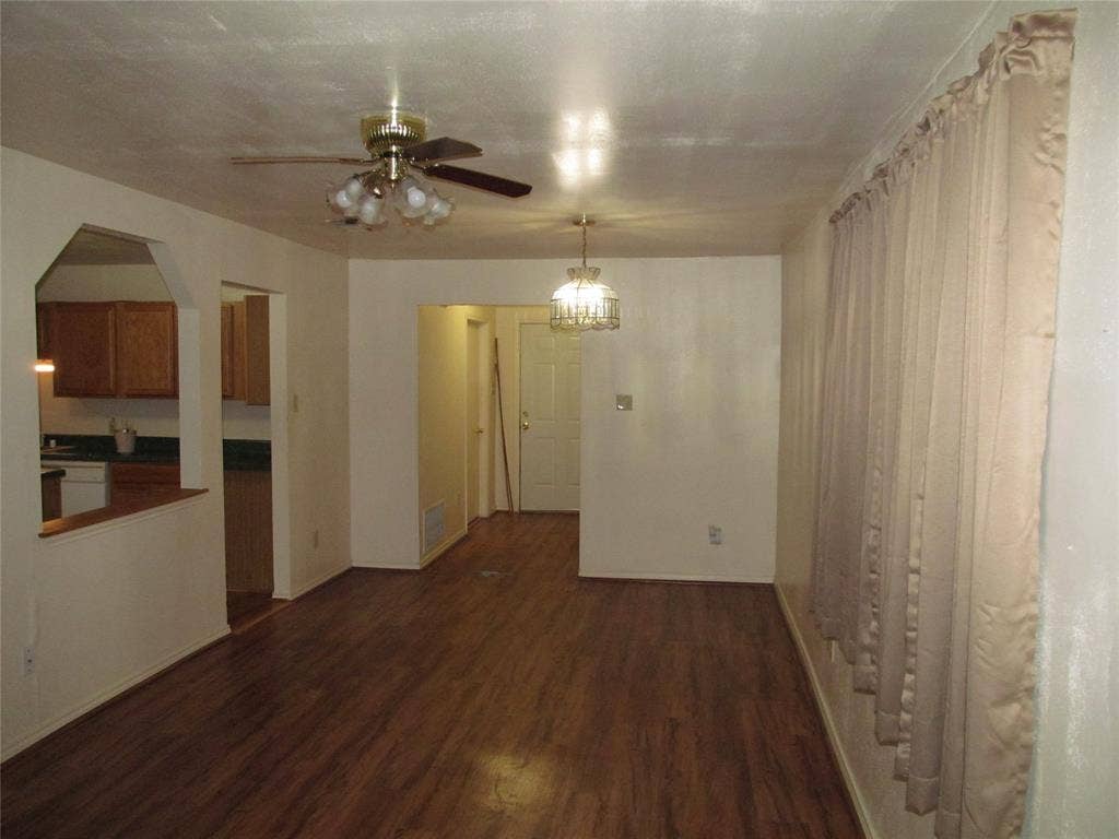 740 Emberwood Drive, Dallas, TX 75232 FAMILY LIVING ROOM OR DEN VIEW OF THE HALL WAY , BACK DOOR AND PARTICAL KITHEN VIEW