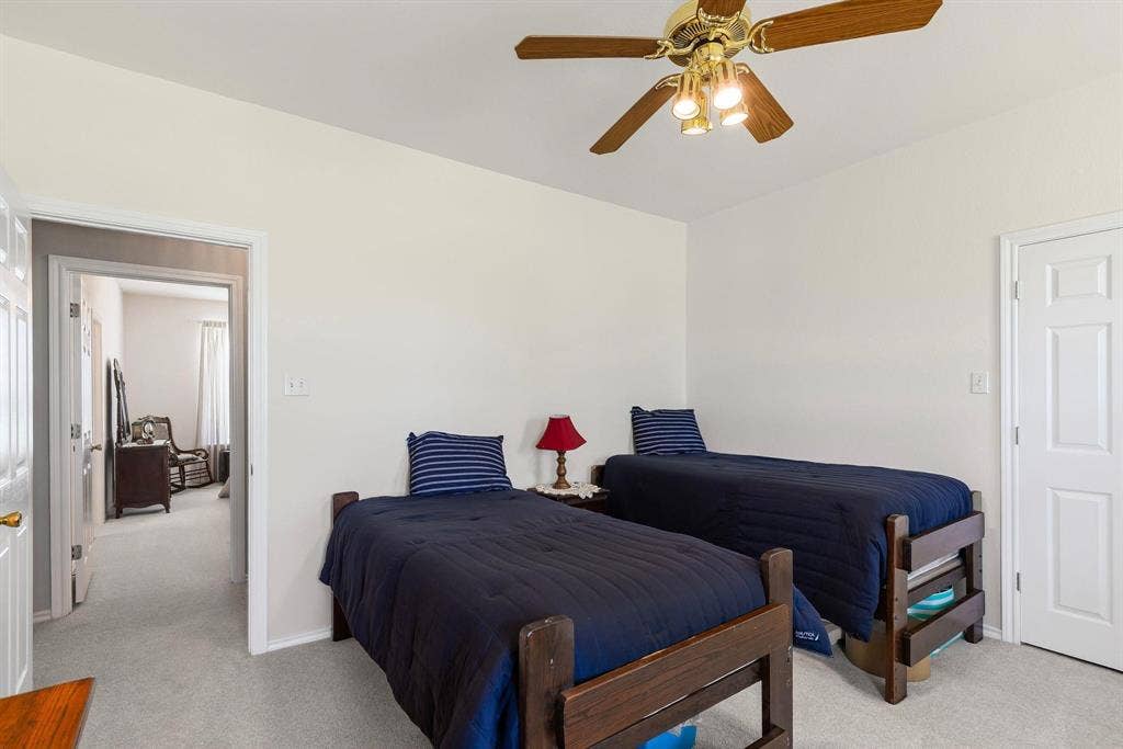 Bedroom featuring light-toned carpeting and neutral wall tones
