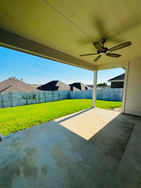 Fort Worth, TX 76123 Covered patio featuring a ceiling fan, concrete flooring, and an expansive lawn