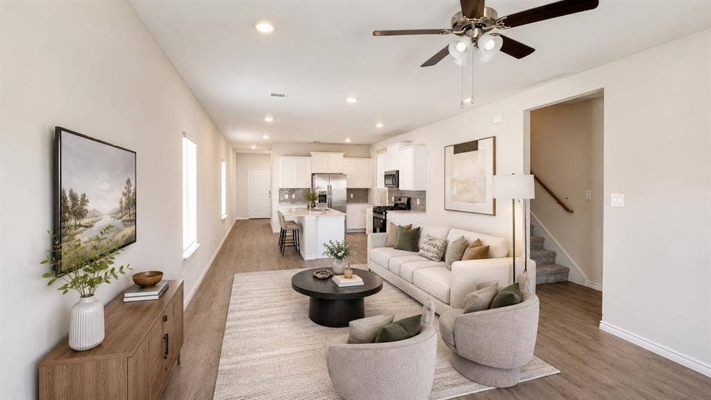 1317 crookpost Drive, Princeton, TX 75407 Open-concept living space featuring wood-finish flooring, recessed lighting, and a ceiling fan with light kit
