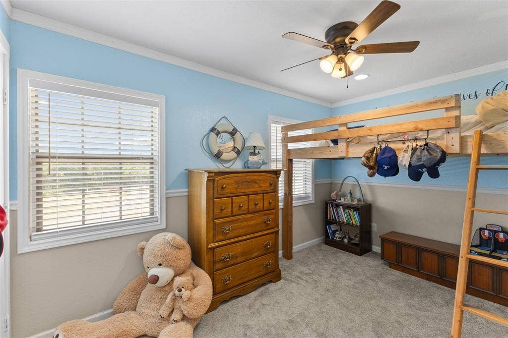 325 Bolton Road, Granbury, TX 76049 Carpeted flooring, white trim, and a ceiling fan with integrated lighting