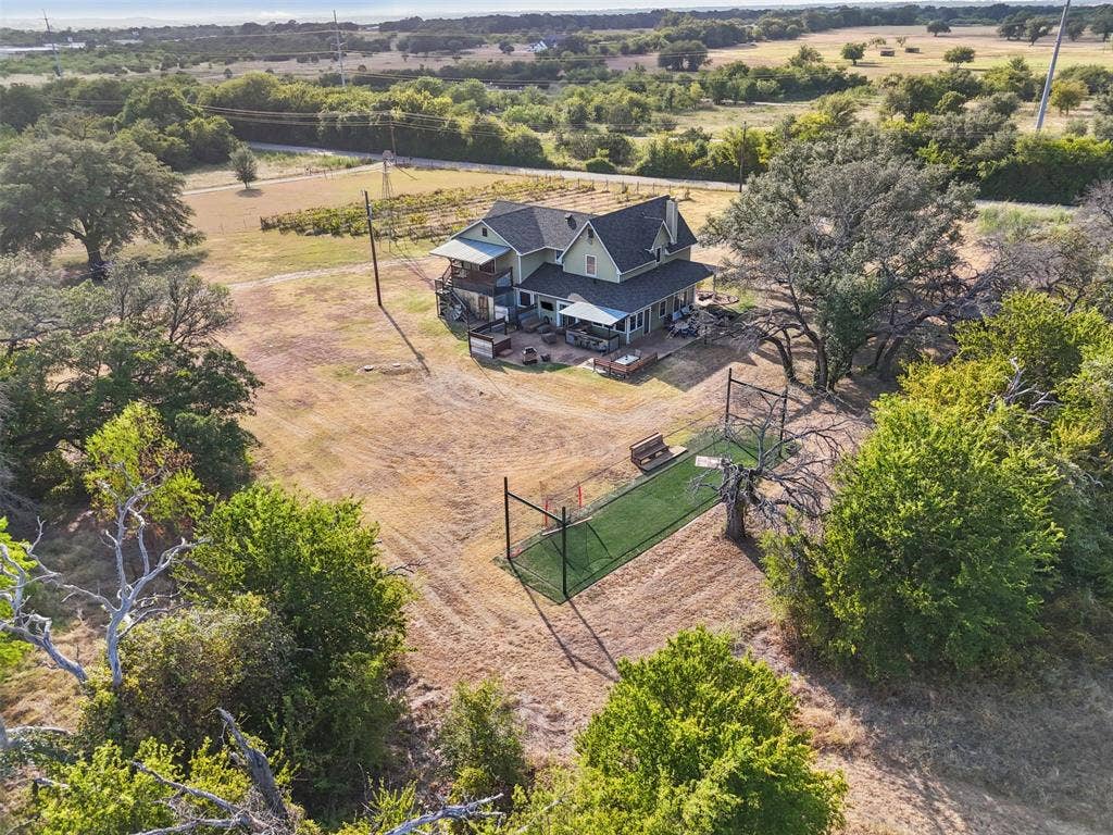 325 Bolton Road, Granbury, TX 76049 Aerial view of the full 5.529 acre gated, cross-fenced property with a private paved drive. Hood County acreage in Granbury ISD, room to spread out.