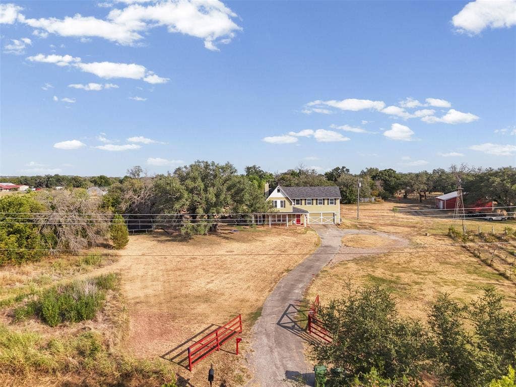 325 Bolton Road, Granbury, TX 76049 Aerial view of the full 5.529 acre gated, cross-fenced property with a private paved drive. Hood County acreage in Granbury ISD, room to spread out.