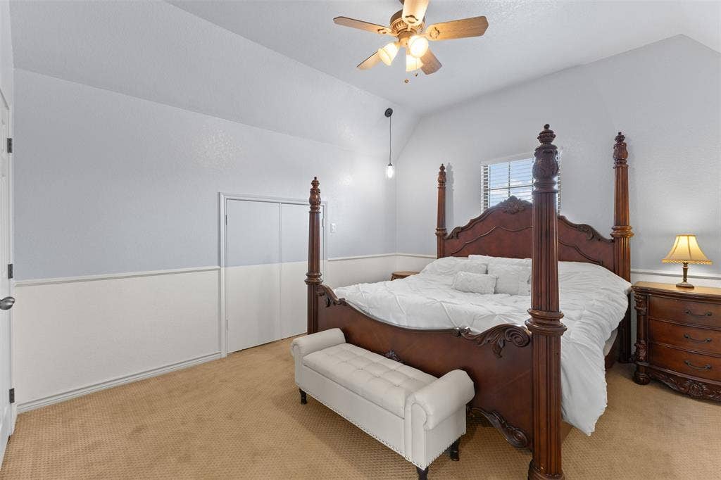 325 Bolton Road, Granbury, TX 76049 Upstairs primary suite with vaulted ceilings and a walk-in closet, added during the 2018 renovation for extra space and privacy.